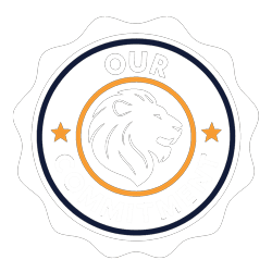 A circular badge with a white scalloped border featuring a lion’s head in the centre. The text reads “OUR COMMITMENT” with stars on either side in orange accents.